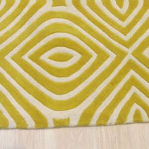 Yellow-green and cream rug featuring a sculpted geometric pattern on light wood flooring.