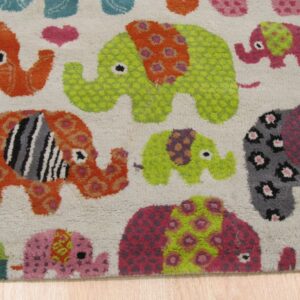 Textured rug with bright orange, lime green, pink, and gray patterned elephants on a cream background over wood floors.