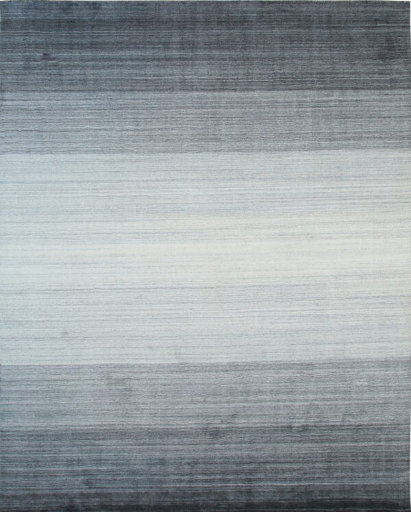 Gradated high-pile rug featuring horizontal bands that transition from dark gray to light gray and white.