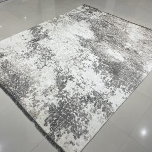 Gray and white mottled abstract rug displayed on a reflective light gray tile floor.