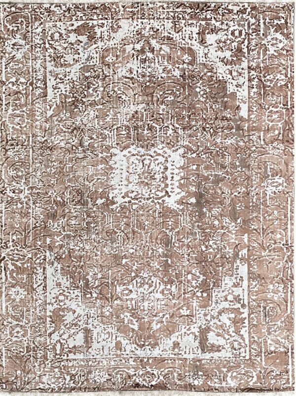Brown and white high-contrast rug with an abstract, distressed traditional medallion and border design.