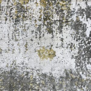 Distressed abstract rug pattern featuring varied pile height in white, dark gray, and yellow-green.