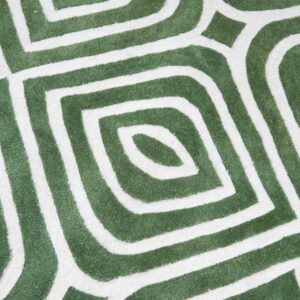 Geometric rug detail in deep green and cream featuring interlocking, concentric, rounded diamond shapes.