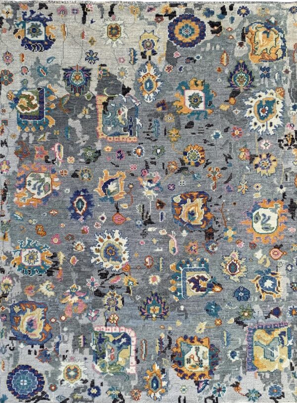 Colorful patterns on gray wool rug