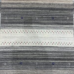 Gray and cream horizontally striped rug detailed with rows of small blue, red, and green woven figures.
