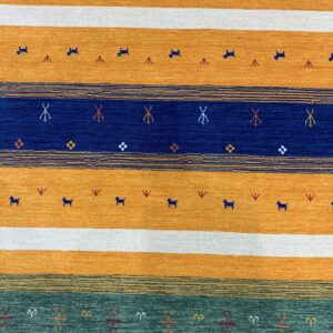 Horizontal striped rug in mustard, white, navy, and teal, decorated with tiny stylized animal and geometric motifs.