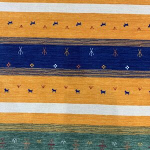 A low-pile rug with stripes of orange, blue, green, and white featuring small animal and geometric motifs.