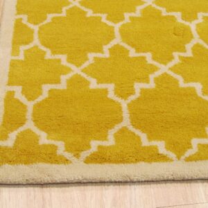 A yellow and cream high-pile rug with a geometric pattern sits on light wood planks.
