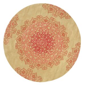 Circular low-pile rug in tan with a radiating red and coral scrollwork medallion pattern.