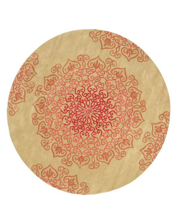 Circular low-pile rug in tan with a radiating red and coral scrollwork medallion pattern.