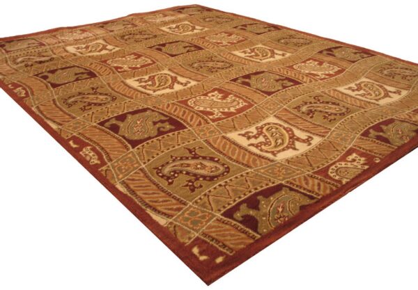 Rust, tan, and olive green rug featuring a dense pile and an intricate diagonal paisley pattern.