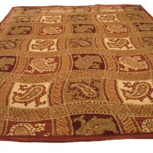 Red-brown, beige, and olive green rug featuring a patchwork grid with detailed paisley shapes.