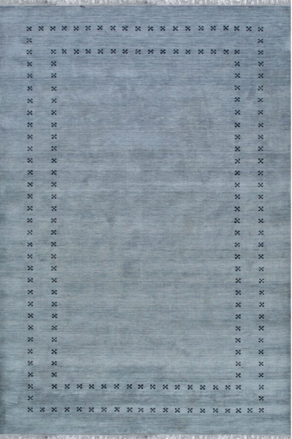 Low-pile slate blue rug with a variegated field and a border of small, dark, geometric motifs.