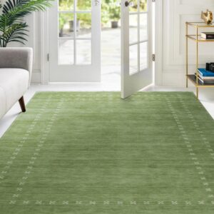 Textured low-pile green rug with minimalist white geometric patterns sits before bright French doors.