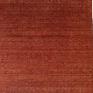 Solid red wool handmade rug.