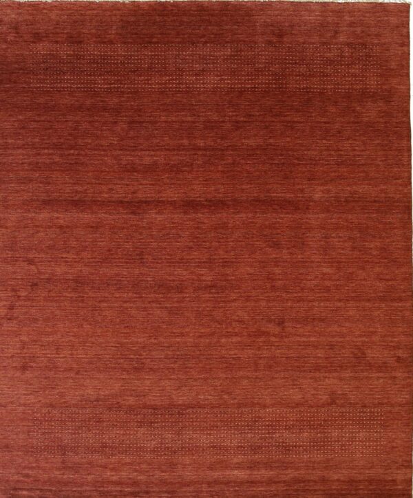 Solid red wool handmade rug.