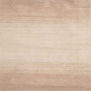 Soft, neutral rug with a horizontal ombre pattern transitioning from deep tan to pale beige.