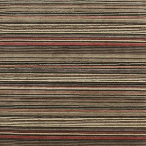 Short-pile rug featuring many varying width horizontal stripes in neutral tones and rust red.