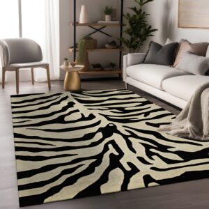 Black and cream zebra print rug lying under a white sofa on dark wood flooring.
