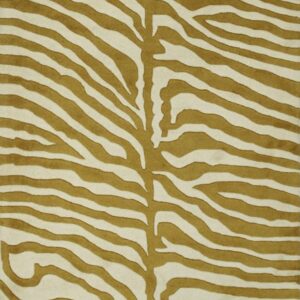Full frame view of a mustard yellow and cream colored zebra print rug.
