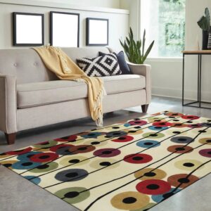 Cream rug with abstract multicolored circles and black connecting lines anchors a modern beige sofa.