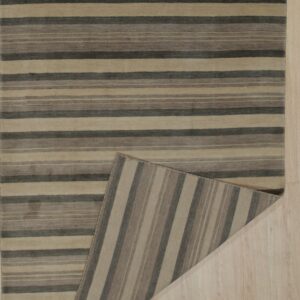 Tan and charcoal horizontally striped rug on a blonde wood floor, revealing the vertically striped backing.