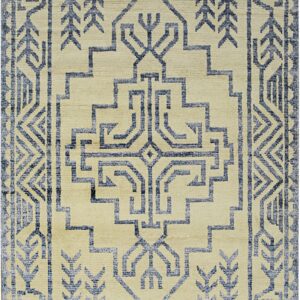 Beige rug featuring an angular blue geometric pattern, complex borders, and a large central stylized motif.