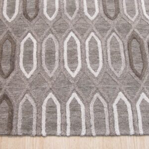 Gray rug featuring a textured, high-low geometric lattice design in white and darker gray over wood planks.