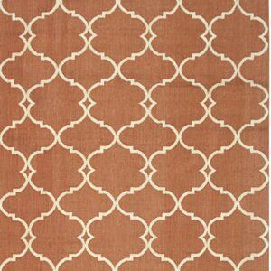 Flatweave rug featuring a cream trellis geometric pattern on a terracotta background.