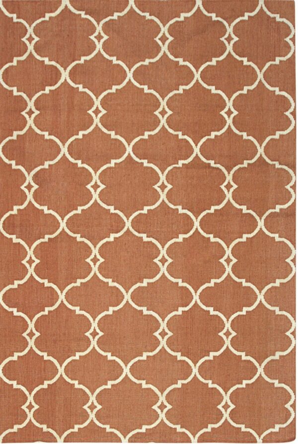 Flatweave rug featuring a cream trellis geometric pattern on a terracotta background.