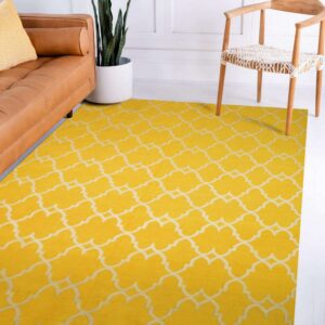 Bright yellow low-pile rug with a white Moroccan lattice pattern next to a tan leather sofa and wood chair.