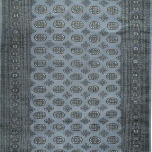 Dusty blue rug featuring traditional geometric medallions and detailed multi-banded borders in gray and yellow.