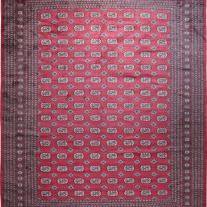 Full view of a red rug featuring repeating gray geometric guls and diamonds within a multi-band dark border.
