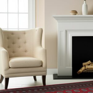 Red rug with blue and gray geometric patterns next to a cream chair and white fireplace.