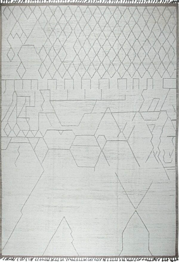 High-textured white rug featuring an abstract linear gray geometric pattern and gray fringe.