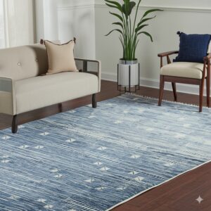 A blue and white patterned rug is centered on dark wood flooring beneath a couch and armchair.