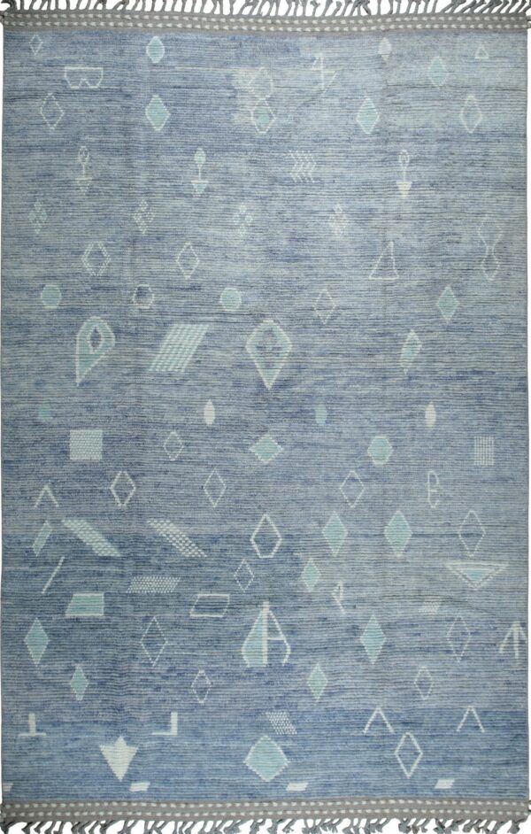 Blue textured rug featuring scattered white and teal geometric shapes, finished with gray borders and fringe.