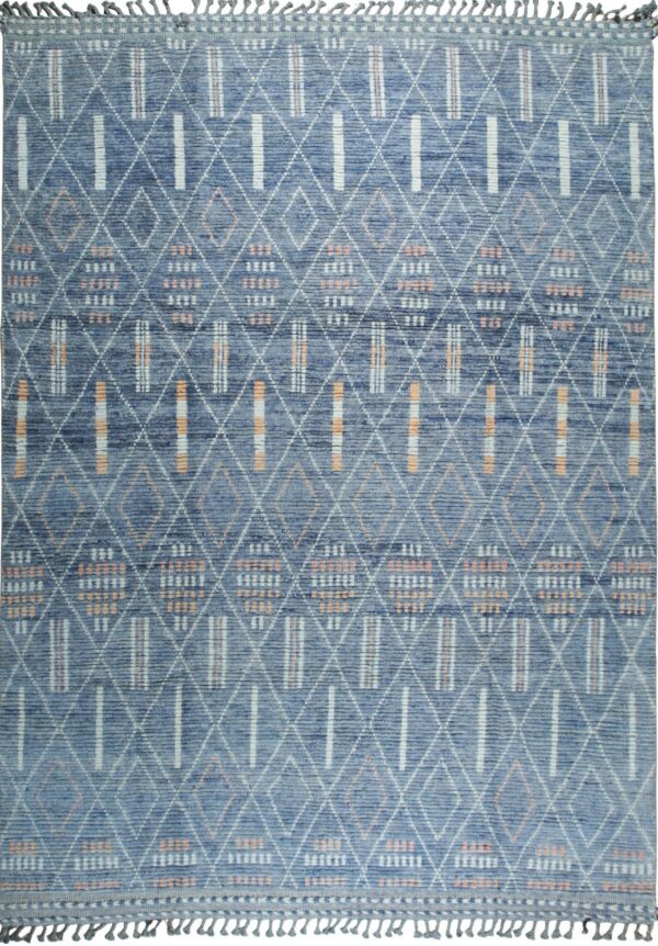 Plush blue rug with white diamond and peach stripe geometric patterns, finished with short tassels.
