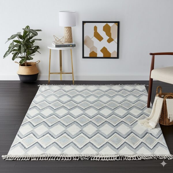 A textured white rug with gray zigzag patterns and fringe rests on dark wood flooring.