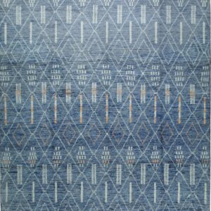 Blue textured rug featuring a white geometric diamond trellis pattern with orange vertical accents and tassels.