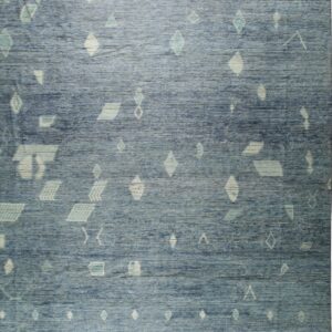 Textured blue rug featuring scattered pale cream and aqua geometric patterns with fringed gray borders.