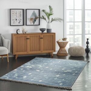 Blue area rug with scattered white and light green shapes anchors a modern room with dark floors.