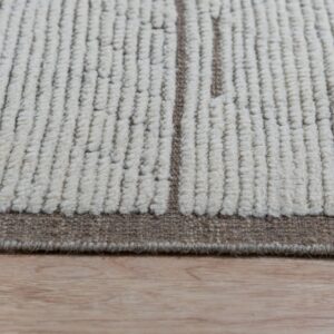 Chunky looped off-white rug with vertical brown patterns and a flat border on light wood flooring.