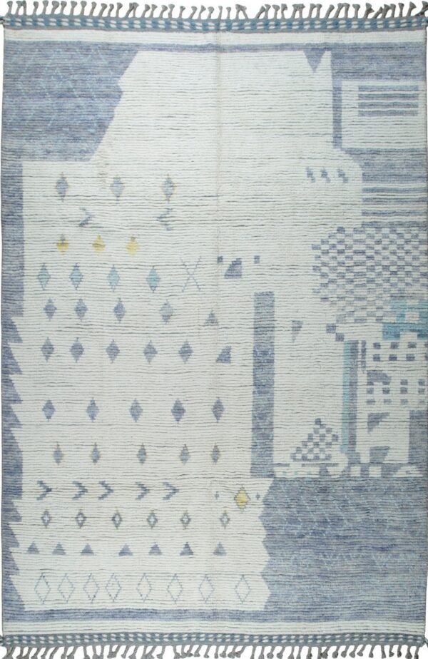 Textured white rug featuring irregular geometric patterns in shades of blue with small yellow accents.