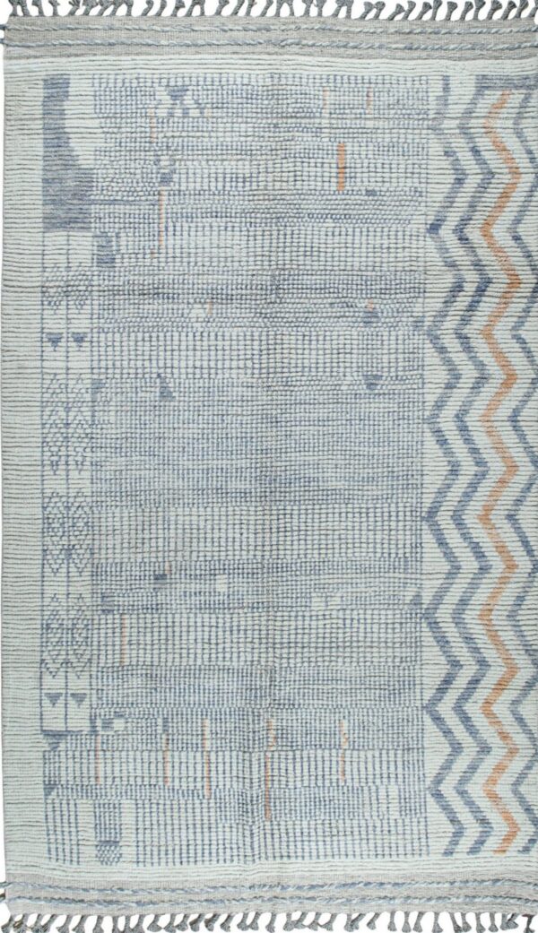 Textured off-white rug with a dense blue grid pattern, orange accents, and wide chevron border.