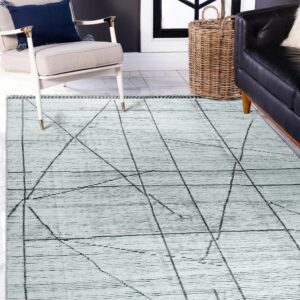 Textured light blue rug featuring abstract intersecting black lines displayed under modern furniture on tile.