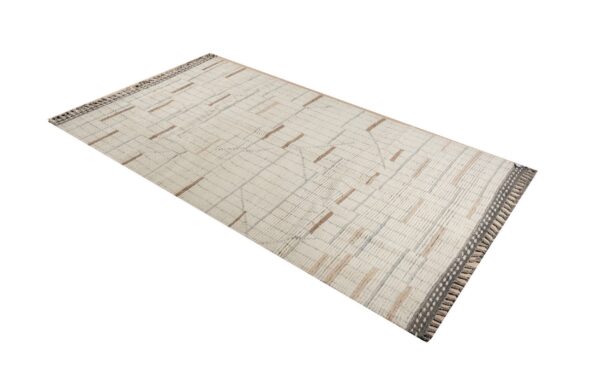 Textured cream rug with brown and gray geometric patterns and decorative gray knotted ends.