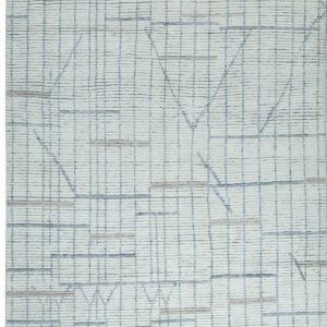 Off-white textured rug with a subtle gray grid pattern and layered blue and beige abstract geometric designs.