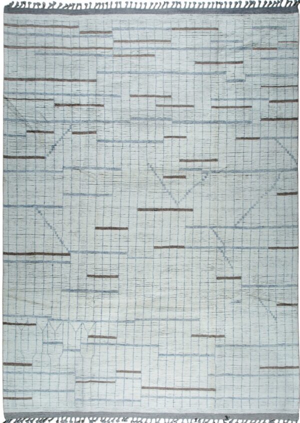 Textured off-white rug featuring a blue grid pattern, brown dashes, subtle geometric lines, and decorative gray fringe.