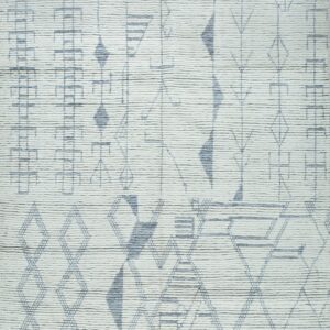 Textured off-white rug with an asymmetrical geometric design in dusty gray-blue and visible fringe.